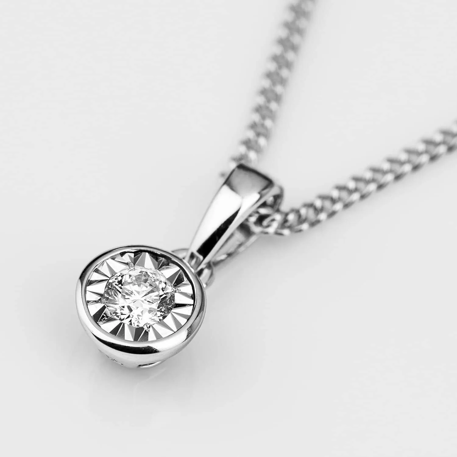 Debut 9ct White Gold Rubover Illusion Set 0.05ct Diamond Pendant