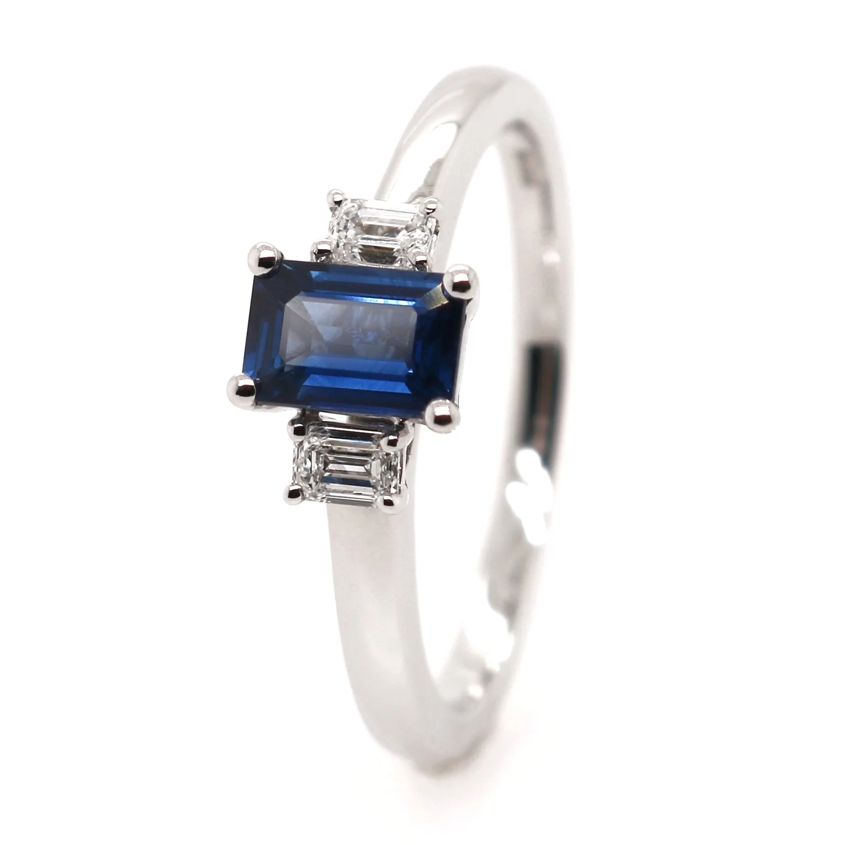 Platinum 0.87ct Emerald Cut Sapphire and Diamond Trilogy Ring
